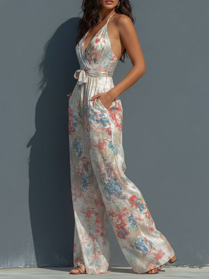 Mono Boho Resort de Satén Floral con Cuello Halter, Diseño Cruzado y Pierna Ancha