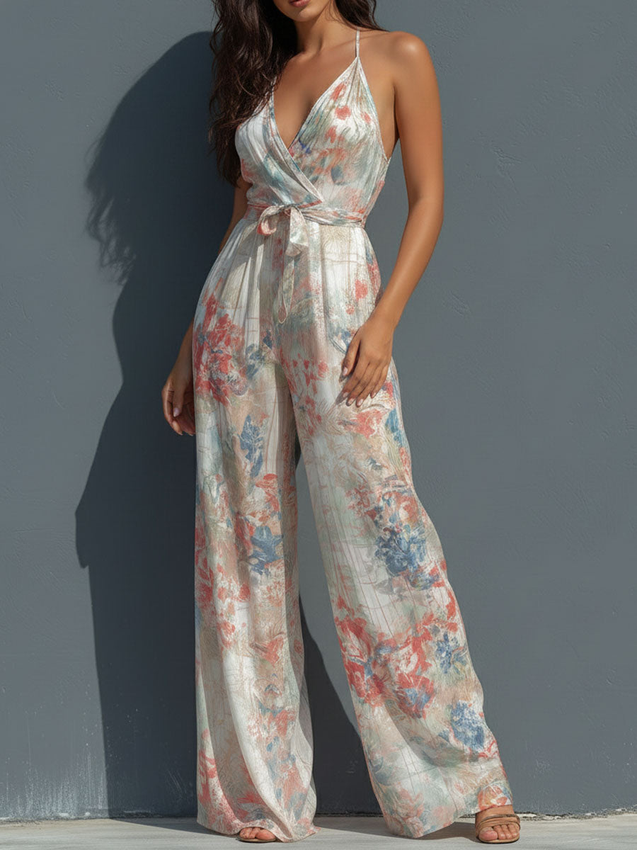 Mono Boho Resort de Satén Floral con Cuello Halter, Diseño Cruzado y Pierna Ancha