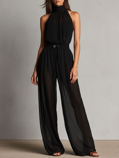 Mono Elegante Negro de Pierna Ancha con Cuello Halter Alto y Detalles Semitransparentes