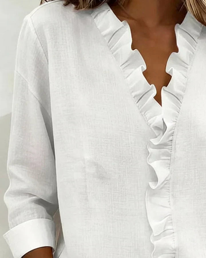 Irene | Blusa con volantes, escote en V y mangas largas